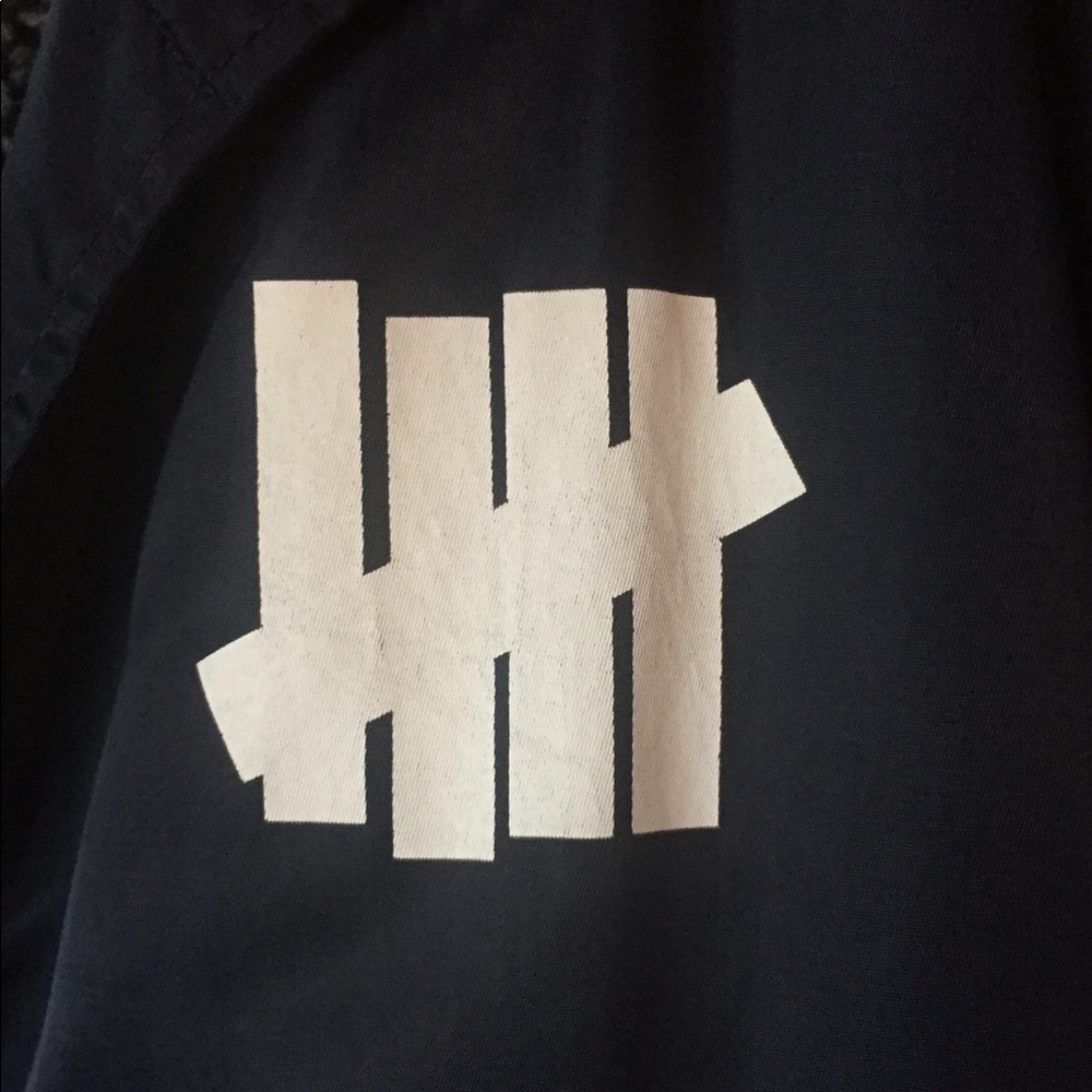 Undefeated Sherpa lined nylon coach jacket.